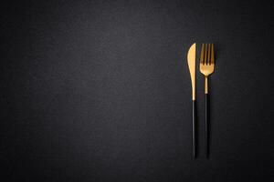 Kitchen knife and fork made of steel with copy space photo