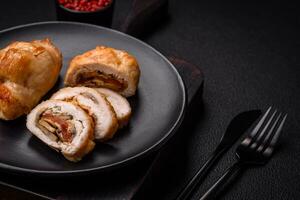 Delicious fresh meat roll made from chicken fillet, mushrooms, spices and herbs photo