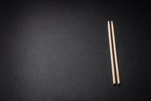 White wooden chopsticks for Asian dishes with copy space photo