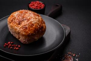 Delicious baked chicken or turkey meat roll with salt and spices photo