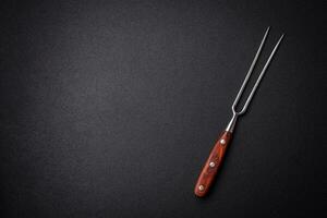 Kitchen knife and fork made of steel with copy space photo