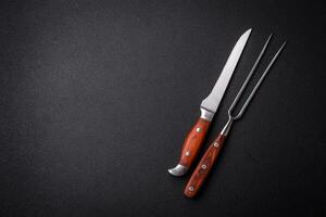 Kitchen knife and fork made of steel with copy space photo