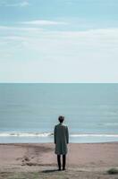 AI generated a man is standing at the beach near the ocean, photo