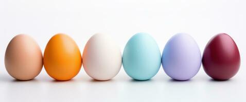 AI generated colorful easter eggs arranged in a row on a white background photo