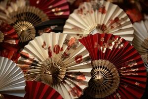 AI generated paper fans with red, ivory and gold patterns photo