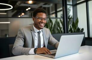 AI generated a business man smiling at his laptop working at an office table photo