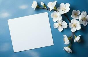 ai generado blanco invitaciones tarjetas con flores en un azul mesa foto