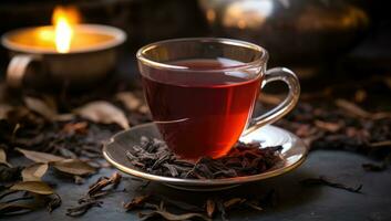 AI generated a cup of black tea with a leaf sitting next to it photo