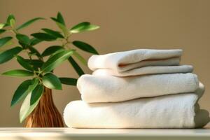 AI generated a stack of white towels stacked together and in a vase with a plant around it photo