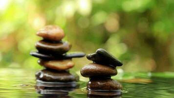 Emotional Balanced rocks pyramid on water with Golden light natural peace concepts bokeh on background video