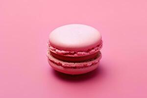 AI generated pink macaron isolated on a pink background photo