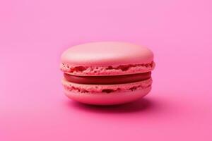 AI generated pink macaron isolated on a pink background photo