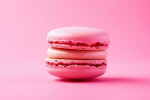 AI generated pink macaron isolated on a pink background photo