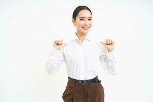 Business and corporate concept. Confident asian woman, saleswoman points at herself with serious face, white background photo