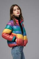 AI generated a female model wearing a rainbow colored puffer jacket photo