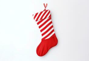 ai generado Navidad calcetín aislado en blanco con caramelo bastones, foto