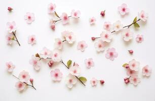 ai generado flores son arreglado en parte superior de un blanco antecedentes foto