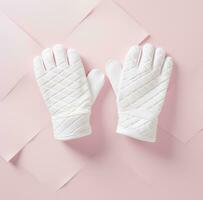 AI generated two knitted white mittens on a pink surface photo