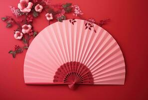 AI generated red paper fan with red leaves and buds and pink background photo