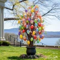 AI generated A picturesque outdoor scene featuring a decorated Easter egg tree and colorful tulips in bloom photo