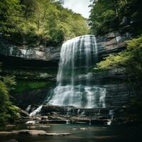 AI generated A soothing waterfall cascading down a rocky cliff with a lush forest in the background photo