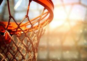 ai generado baloncesto remojar desde cesta red en baloncesto campo foto