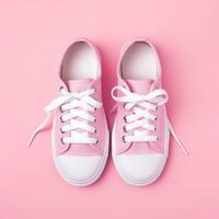 AI generated womens tennis sneakers with white laces on a pink background. photo