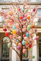 ai generado un maravilloso foto de un floreciente Cereza florecer árbol con vistoso Pascua de Resurrección huevos colgando desde sus ramas