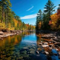 AI generated A calm river winding through a forest with vibrant fall foliage and a clear blue sky above photo