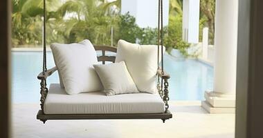 AI generated A Serene Outdoor Porch Swing Perfectly Positioned for Reading, Relaxing, or Tea Sipping by a Poolside Terrace photo
