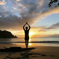 AI generated A man doing yoga on a beach, with the ocean and sunrise in the background photo