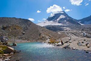 a mountain with a lake photo