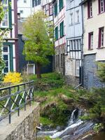 a small stream running through a city photo