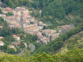 a small town surrounded by trees photo