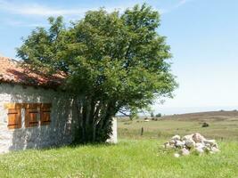 a small stone house photo