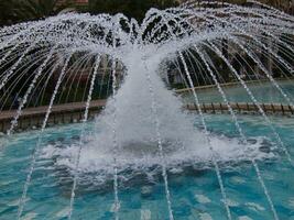 a fountain in a pool photo