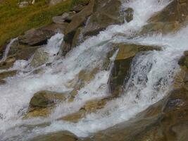 water flowing over rocks photo