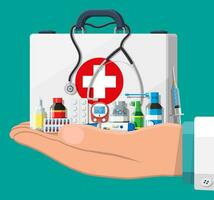 Medical first aid kit with different pills and medical devices. Medical tools, drugs, stethoscope, syringe, glucometer, thermometer. Healthcare diagnostics. Urgency emergency. Flat vector illustration