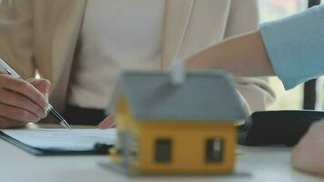 Real estate agents and new homeowners sign home sales or lease agreements. Ready to sign a home or office loan agreement video