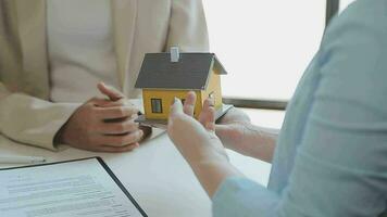 Real estate agents and new homeowners sign home sales or lease agreements. Ready to sign a home or office loan agreement video