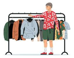 hombre cerca estante con ropa. de los hombres ropa en percha. hogar o tienda armario. ropa y accesorios. varios colgando ropa. chaqueta, camisa, vaqueros, pantalones. dibujos animados plano vector ilustración