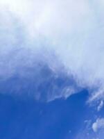 blue sky background with tiny cloudscape as background or wallpaper photo