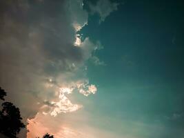 Beautiful sky with clouds at sunset. Natural background. Toned. photo