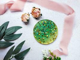 flat lay composition of resin and wood coaster on grey background photo