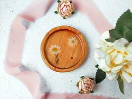 flat lay composition of resin and wood coaster on grey background photo