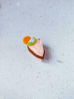 a closeup shot of handmade felt woolen toy on a white background. Selective focus. photo