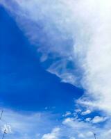 blue sky background with tiny cloudscape as background or wallpaper photo