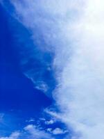 blue sky background with tiny cloudscape as background or wallpaper photo