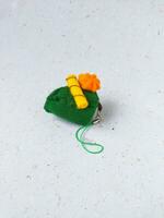 a closeup shot of handmade felt woolen toy on a white background. Selective focus. photo