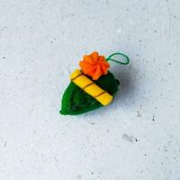 a closeup shot of handmade felt woolen toy on a white background. Selective focus. photo